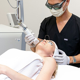 woman laying down receiving HALO treatment